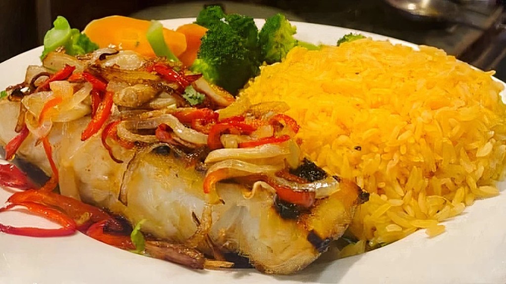 Seared white fish with vegetables and yellow rice